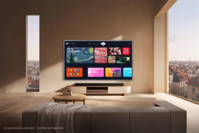 Samsung S99H OLED television mounted on a wall showing an artwork